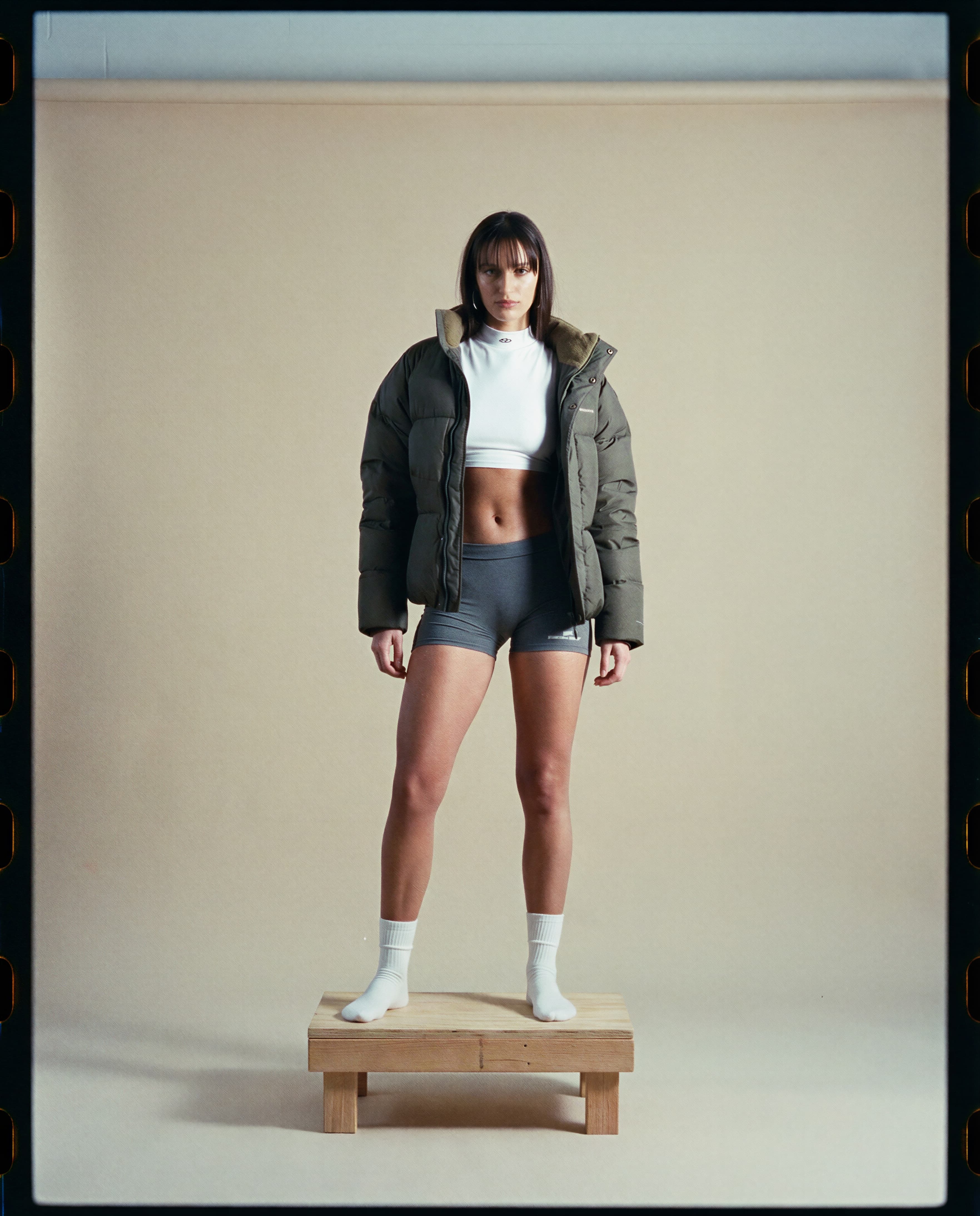 Woman in puffer jacket — customer profile data points